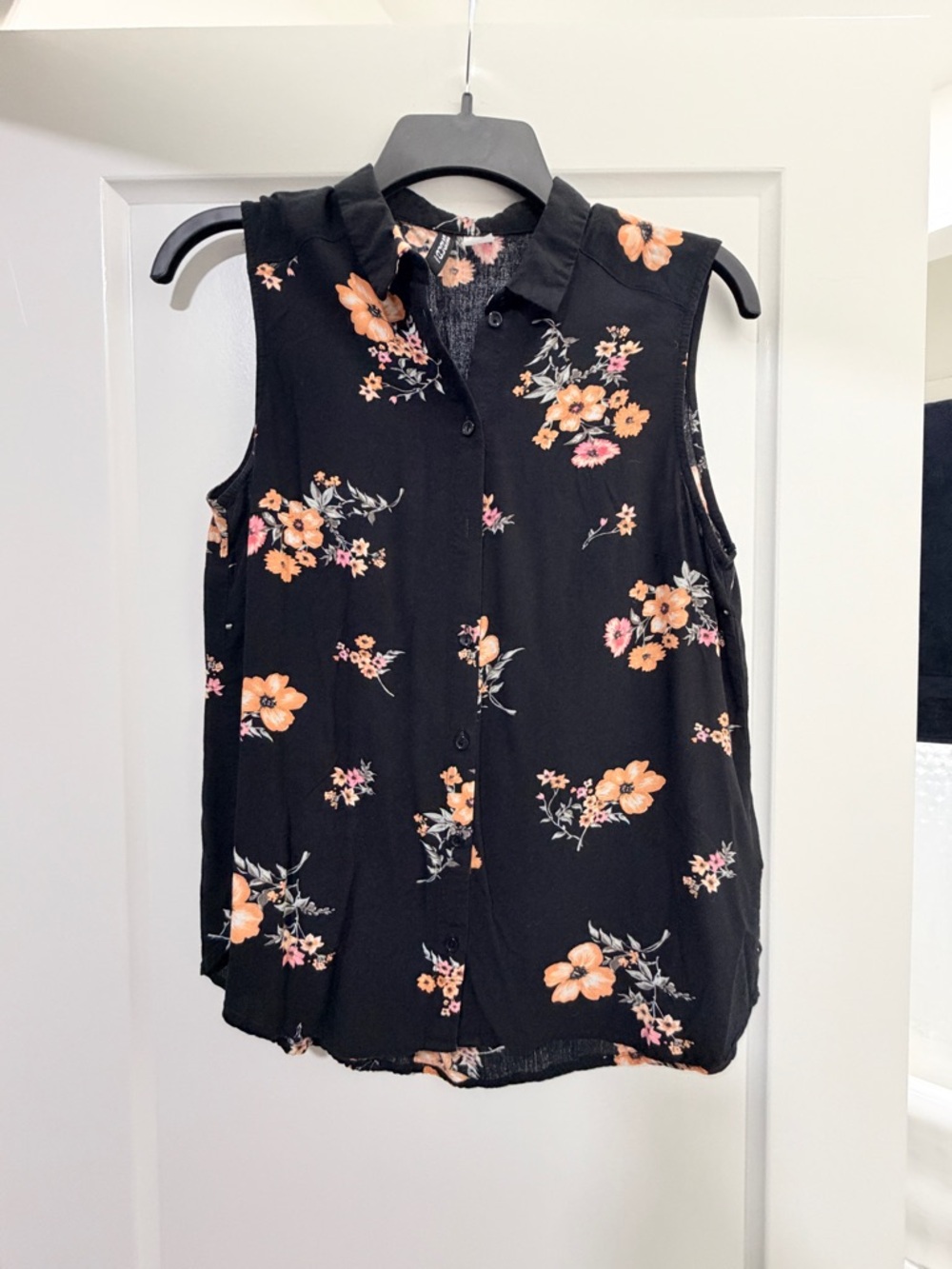 Divided Black Sleeveless Floral Button-Front Blouse
